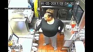Watch: Woman climbs drive-thru to steal food and Happy Meal toys