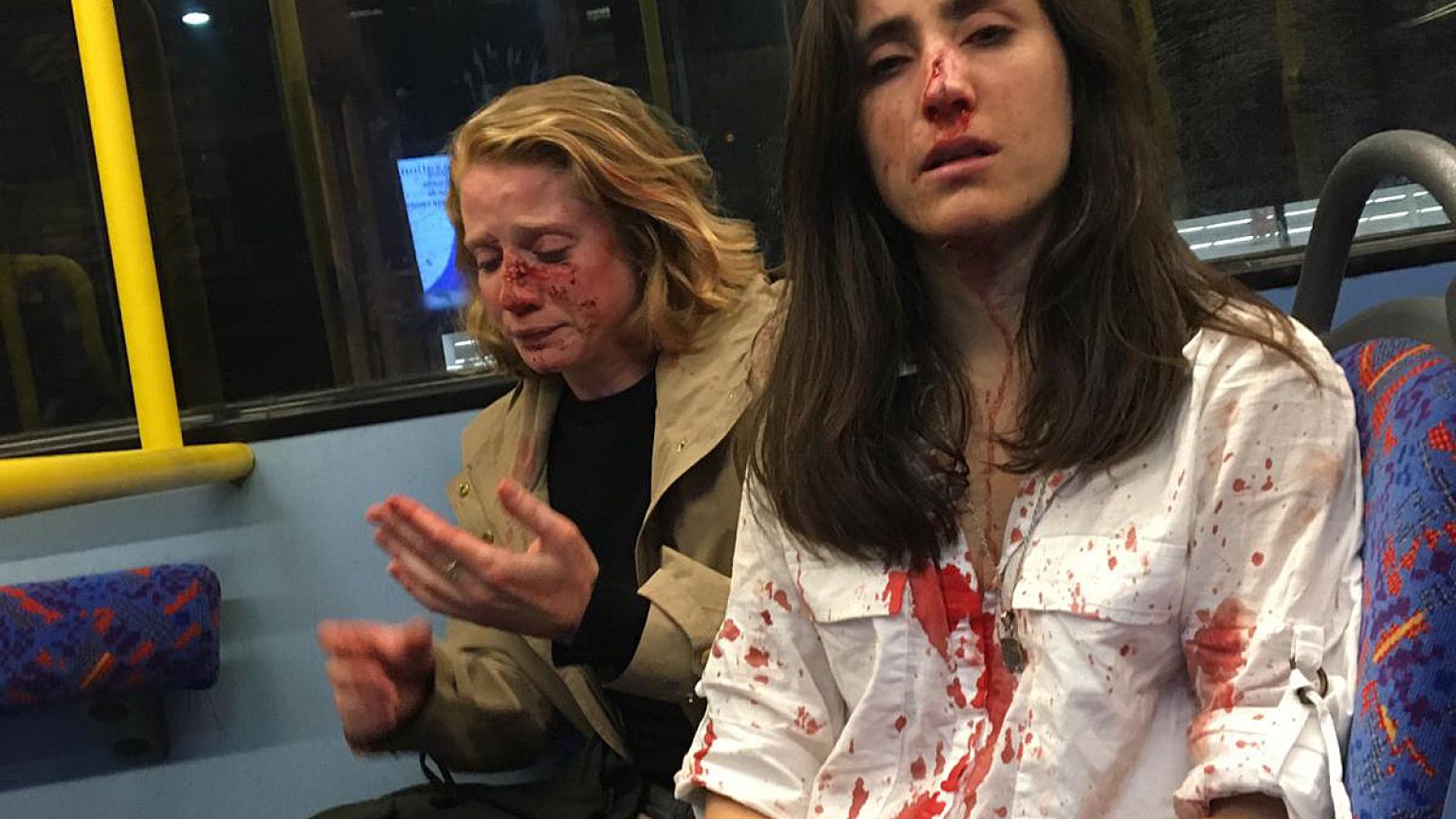 Chris, left, and Melania, on a bus in London.