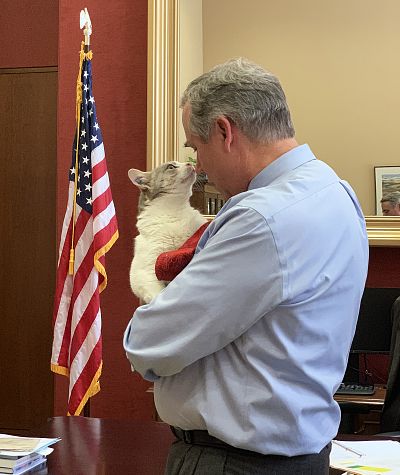 Delilah, who was freed from a government testing program, visits Sen. Jeff Merkley at the Capitol on July 25, 2019.