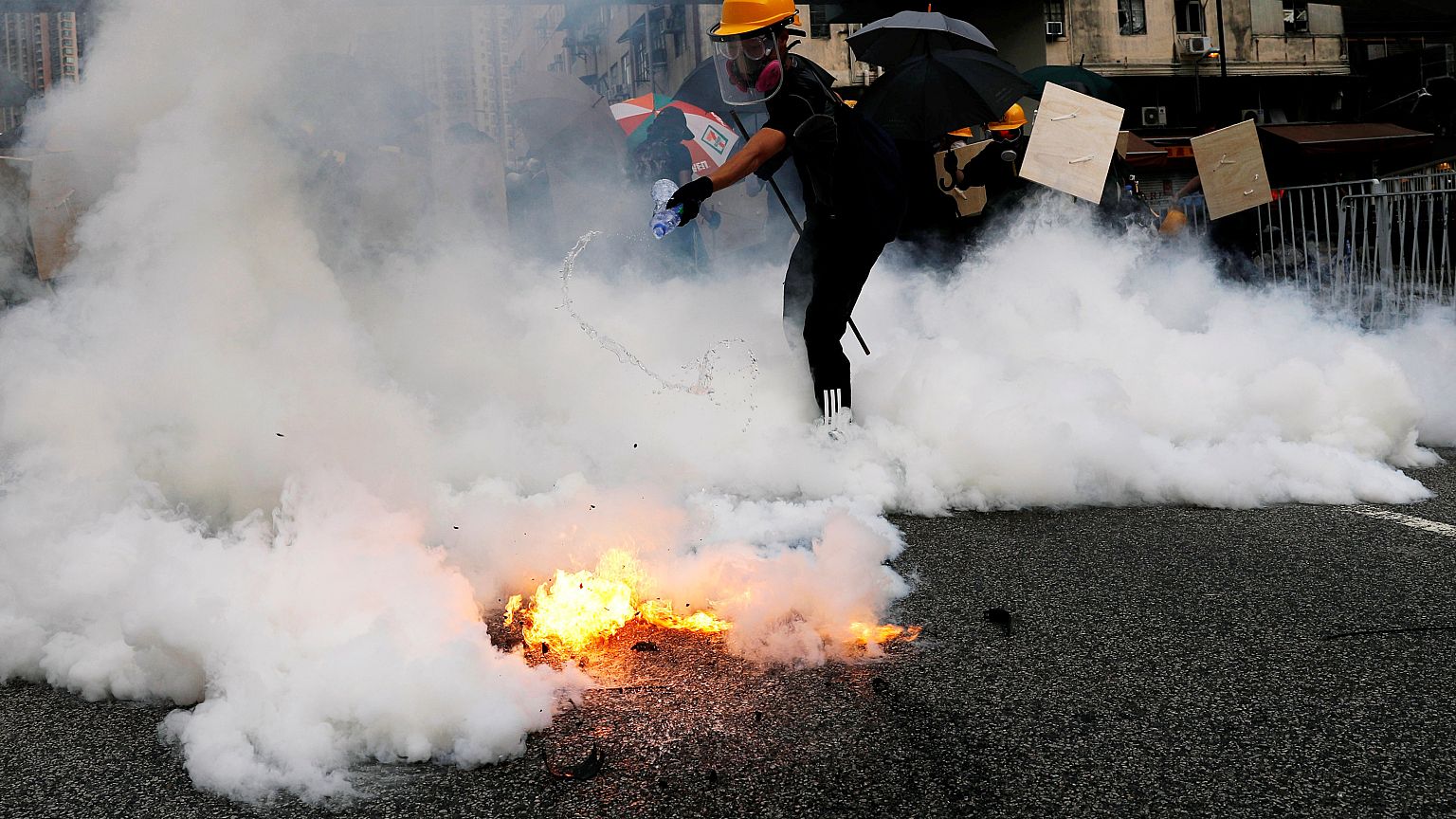 Demonstrators march to protest against in Yuen Long