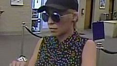 Image: Police are searching for a suspect, dubbed the "Pink Lady Bandit," w