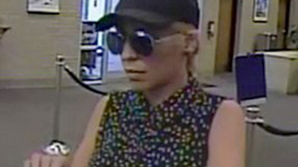 Image: Police are searching for a suspect, dubbed the "Pink Lady Bandit," w Image: Police are searching for a suspect, dubbed the "Pink Lady Bandit," w
