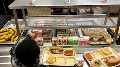 Students fill their lunch trays at J.F.K Elementary School in Kingston, New