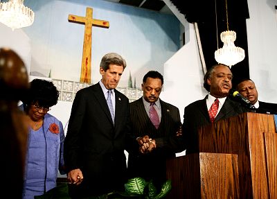 Sen. John Kerry holds hands with retired Rep. Carrie Meek, Rev. Jesse Jackson and Rev. Al Sharpton at the Friendship Missionary Baptist Church in Miami in 2004.