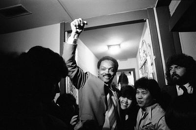 Rev. Jesse Jackson arrives at a home in California after campaigning for president in 1984.