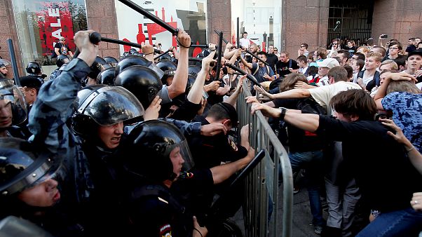 Image: Demonstrators clash with Russian police during a rally for election Image: Demonstrators clash with Russian police during a rally for election