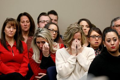 Victims and supporters look on as Rachael Denhollander speaks at the sentencing hearing for Larry Nassar in Lansing, Michigan, on Jan. 24, 2018.