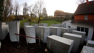 Activists build Holocaust memorial replica outside German far-right politician’s home