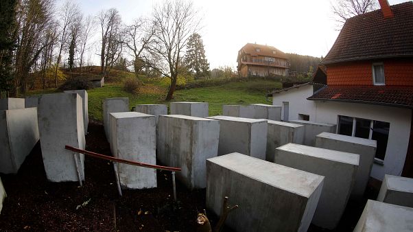 Activists build Holocaust memorial replica outside German far-right politician’s home Activists build Holocaust memorial replica outside German far-right politician’s home