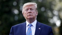 Image: President Donald Trump speaks to reporters before leaving the White 