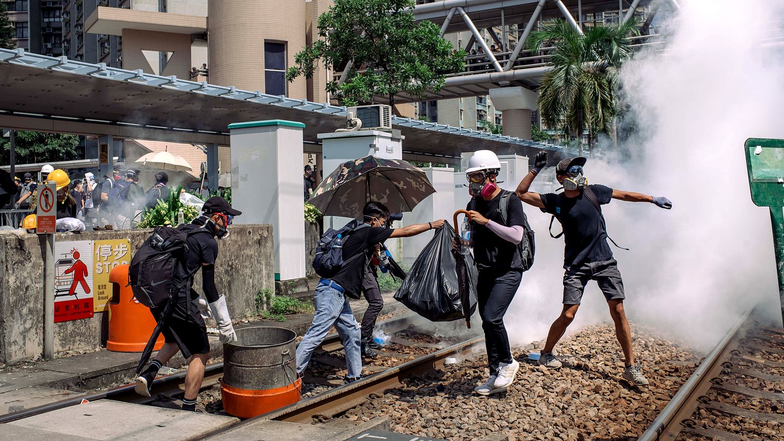 Image: Protesters get hit with tear gas