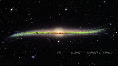 Warped galaxy with the distribution of the young stars (Cepheids) in the di