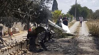 Image: The wreckage after a helicopter and small plane collided in Mallorca