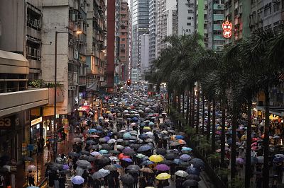 A sea of protesters walk down one of Hong Kong\'s main avenues on Aug. 18. 