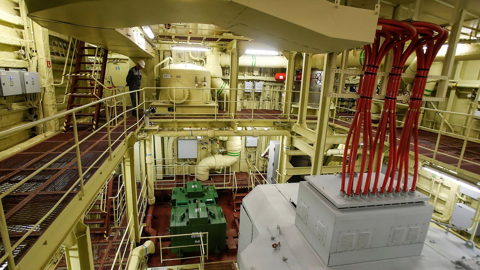 Image: An employee inside the machinery compartment of the floating nuclear