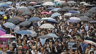Image: Hundreds of accountants march at Chater Garden, in Hong Kong,