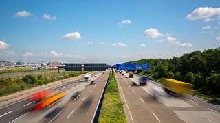 Image: Multilane Autobahn highway with blurred trucks and cars, Germany.