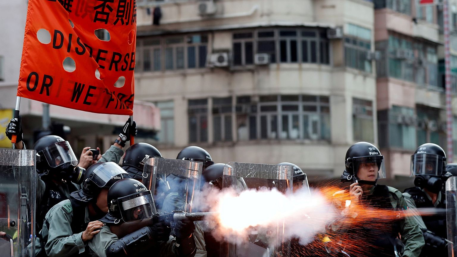Image: Police officers fire tear gas as anti-extradition bill protesters de