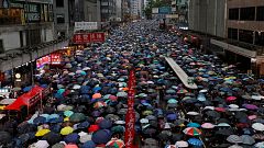 Image: People march during a rally to demand democracy and political reform