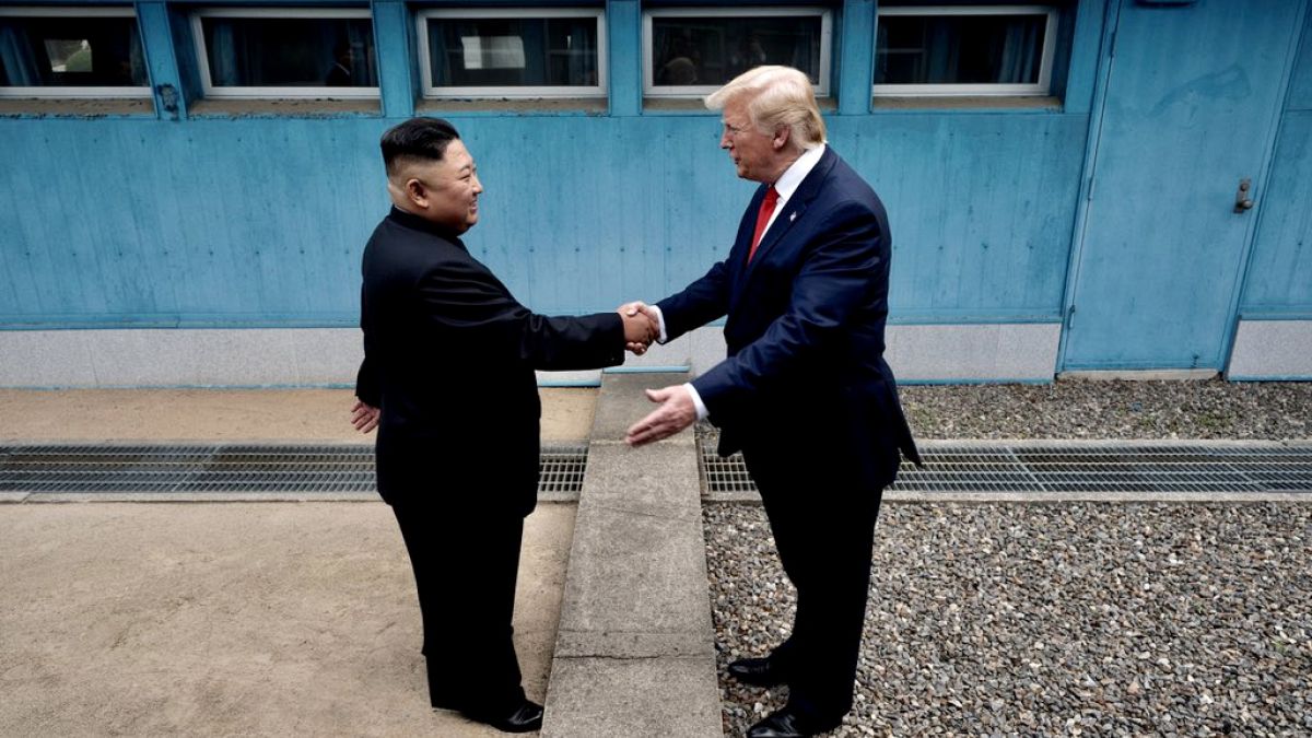Image: President Donald Trump and North Korean leader Kim Jong Un shake han