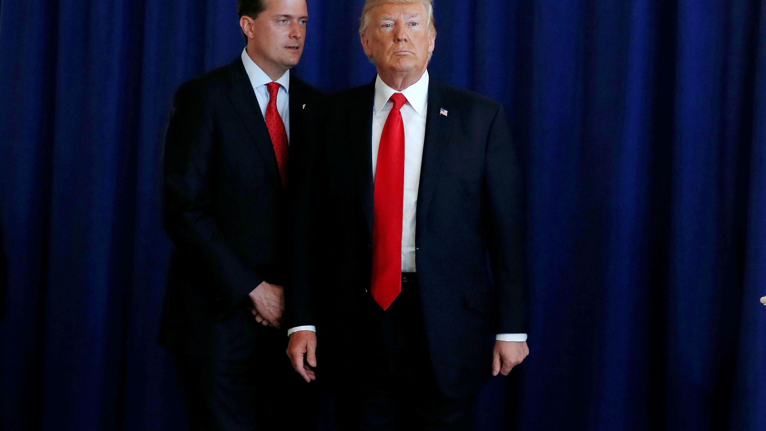 Image: White House Staff Secretary Rob Porter reminds President Donald Trum
