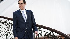 Image: Treasury Secretary Steven Mnuchin walks to a breakfast at the G7 Sum