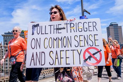 Moms Demand Action and other gun violence prevention organizations participate in the Solidarity Walk With Gun Violence Survivors across the Brooklyn Bridge on June 8, 2019 in New York City.