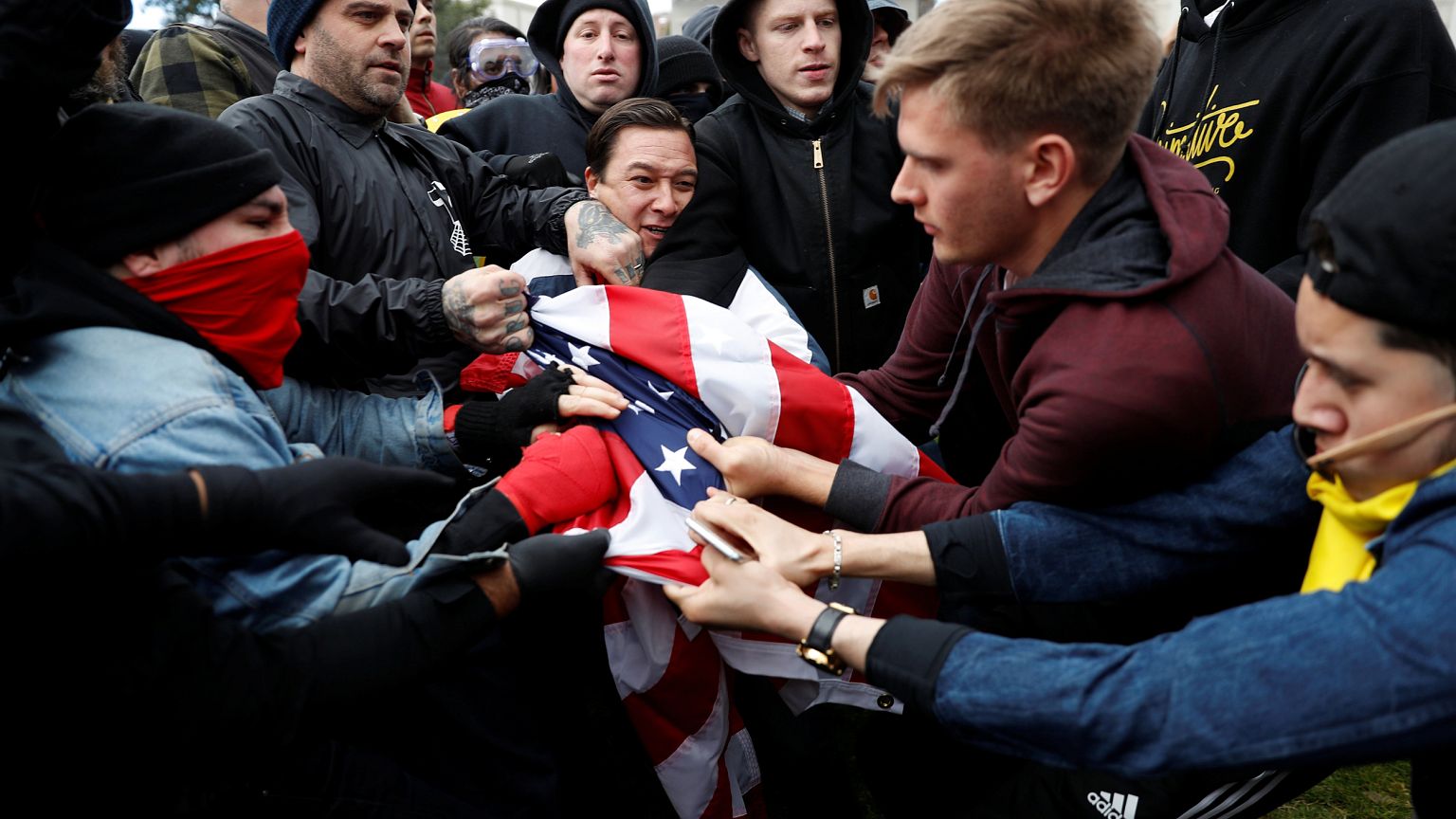 Image: Protesters fight for a U.S. flag