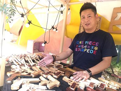 Yang Fang, who sells toy guns in a Beijing market.