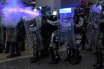 Police fire tear gas during a protest in Tsuen Wan district of Hong Kong on Sunday. 