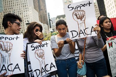 Marlon Ruales, Dayana Arrue, Sofia Ruales, and Erica Ruales, originally from Ecuador, watch Attorney General Jeff Sessions\' remarks on ending DACA on a smartphone before a protest in New York on Sept. 5, 2017.