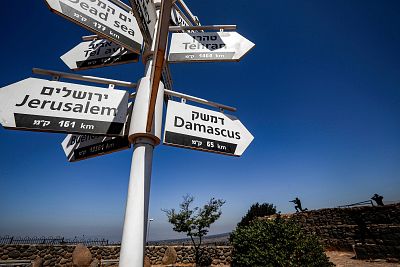 An Israeli army outpost in the Golan Heights shows a directional sign for cities and places across the world.