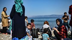 Image: Migrants from Afghanistan arrive after crossing the Aegean Sea from 