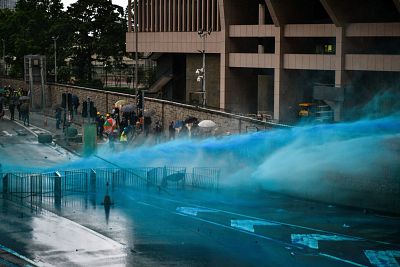 The water cannon fired blue-dyed water, traditionally used elsewhere in the world to make it easier for police to identify protesters later.