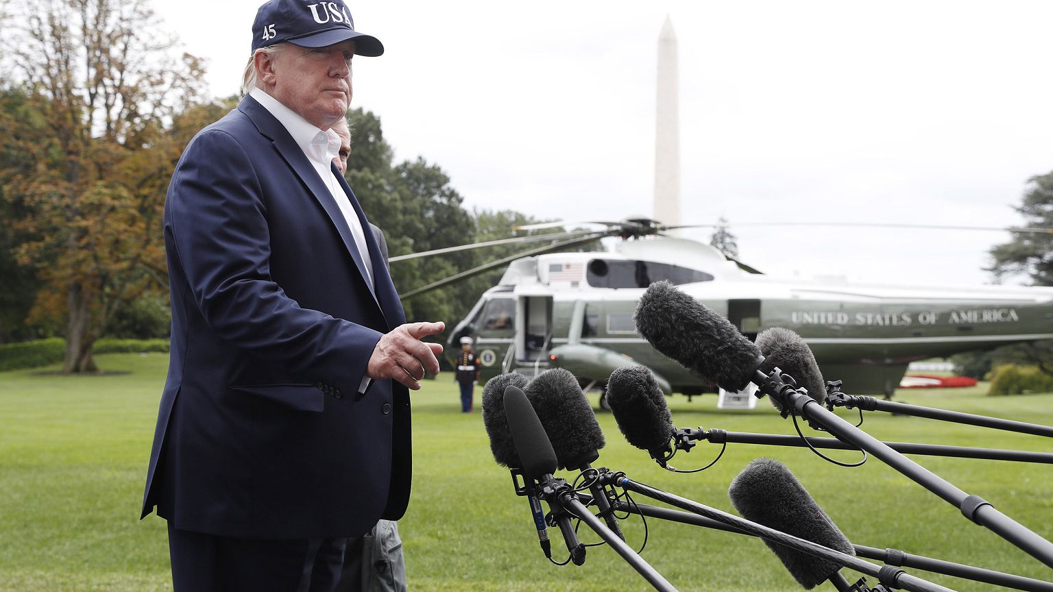 Image: President Donald Trump speaks to the media as he returns to the Whit