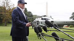Image: President Donald Trump speaks to the media as he returns to the Whit