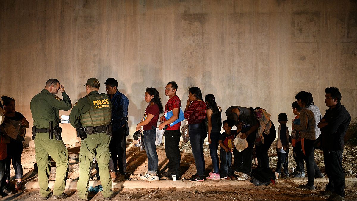 Image: Migrant families turn themselves to U.S. Border Patrol to seek asylu