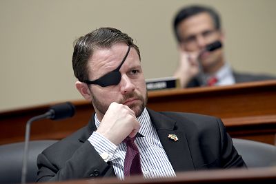 Rep. Dan Crenshaw, R-Texas listens as during a House Budget Committee on Capitol Hill on March 12, 2019.