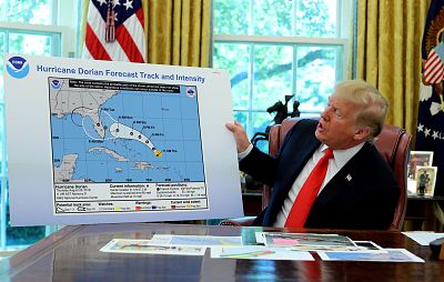 President Donald Trump holds an early projection map of Hurricane Dorian in the Oval Office on Sept. 4, 2019.