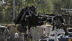 Image: Resolute Support (RS) forces remove a destroyed vehicle after a car 