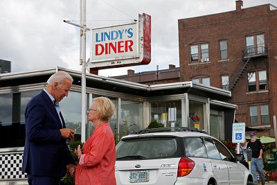 Former Vice President Joe Biden talks with a woman outside Lindy\'s Diner in Keene, New Hampshire, on Aug. 24, 2019.