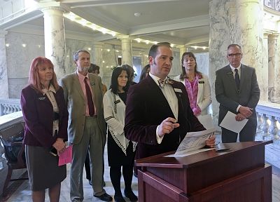 Rep. Bryan Zollinger, a Republican from Idaho Falls, at podium, speaks to reporters to detail legislative proposals a group of Republican lawmakers are urging legislative leaders to give full hearings In Boise, Idaho, on Feb. 9, 2018.