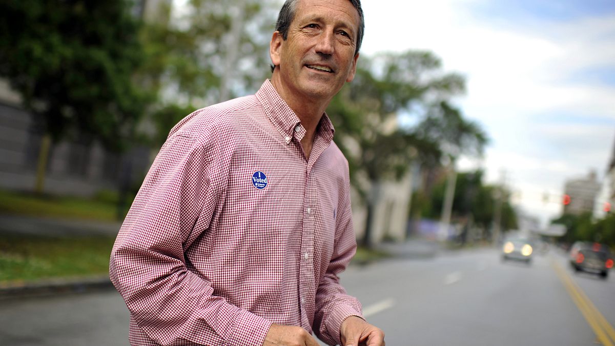 Image: Former Gov. Mark Sanford leaves a polling place in Charleston, S.C.,