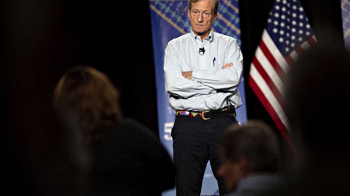 Image: Tom Steyer listens during a town hall event in Ankeny, Iowa, on Jan.