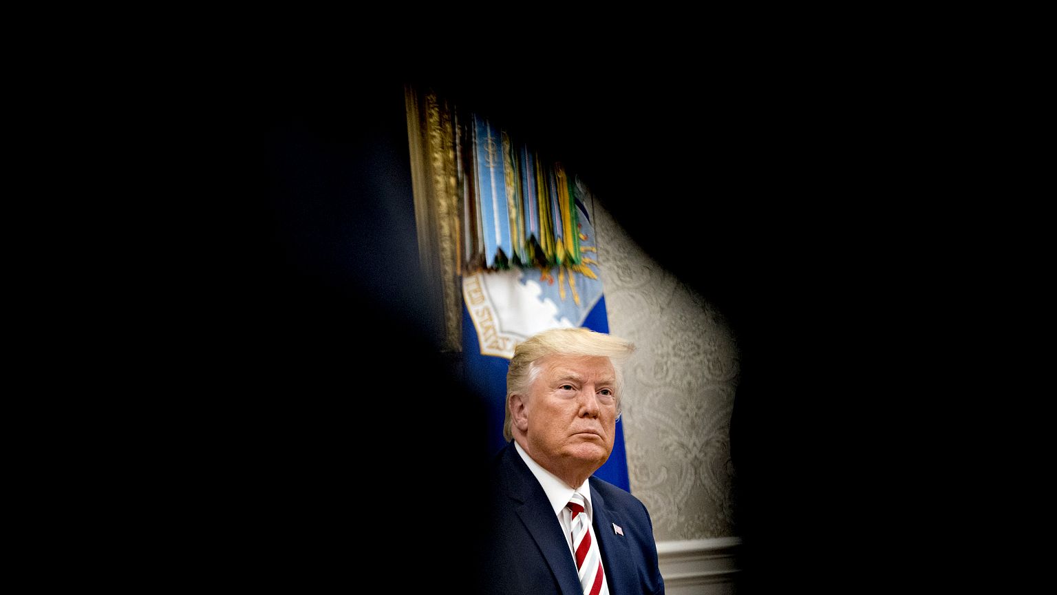 Image: President Donald Trump listens to a question in the Oval Office on A