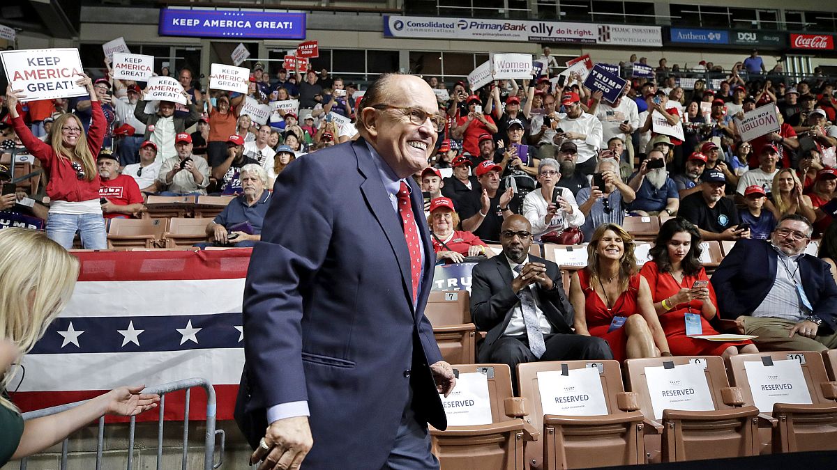 Image: Former New York City Mayor Rudy Giuliani smiles as he arrives to Pre