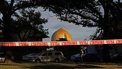 Image: A police officer stands guard in front of the Masjid Al Noor mosque 