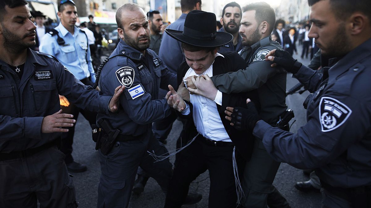Image: Police detain ultra-Orthodox Jews during a protest against Israeli a