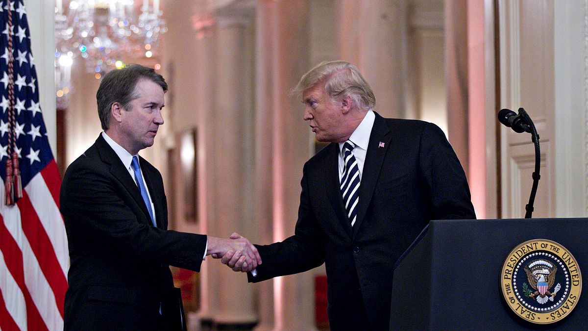 Image: President Donald Trump shakes hands with Brett Kavanaugh, associated