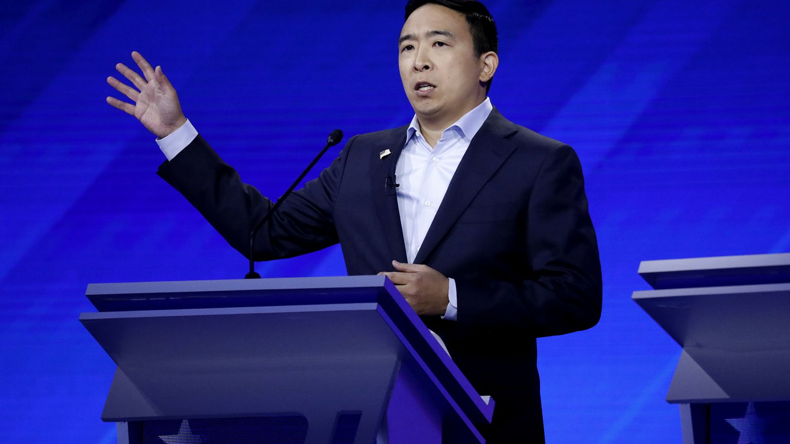 Image: Andrew Yang speaks at the Democratic presidential debate in Houston,
